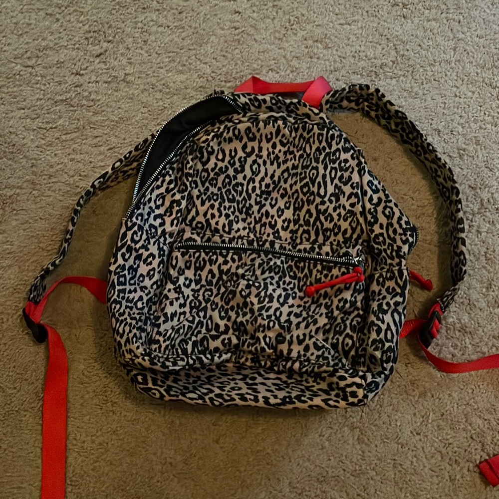 Leopard backpack with red straps